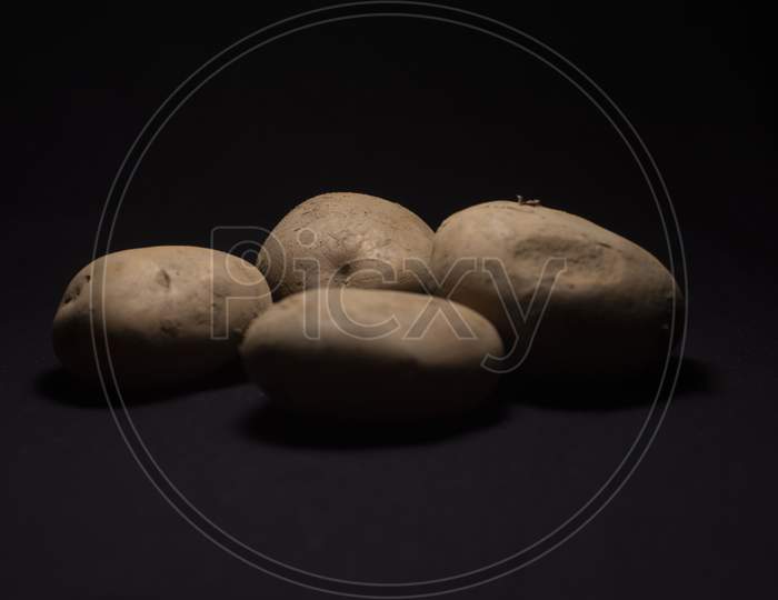 A Collection Of Potato In Dark Copy Space Background. Food And Product Photography.