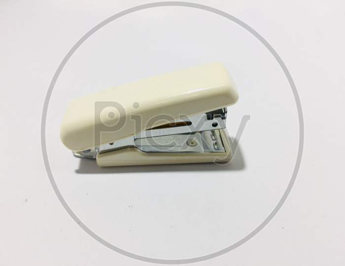 White and metal stapler over a white background