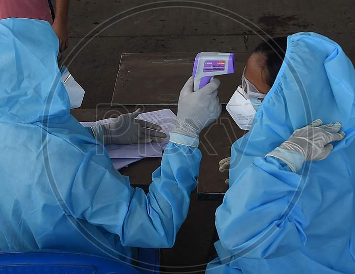 Health Workers Conducting The Thermal Screening During The Ongoing Nationwide Lockdown In The Wake Of Coronavirus Pandemic, In Chennai