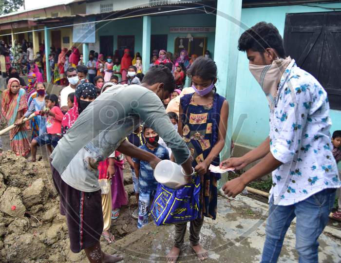 Volunteers Distribute Free Rice And Money Among School Students During Nationwide Lockdown Amidst Coronavirus Or COVID-19 Pandemic in Nagaon on May 14 2020