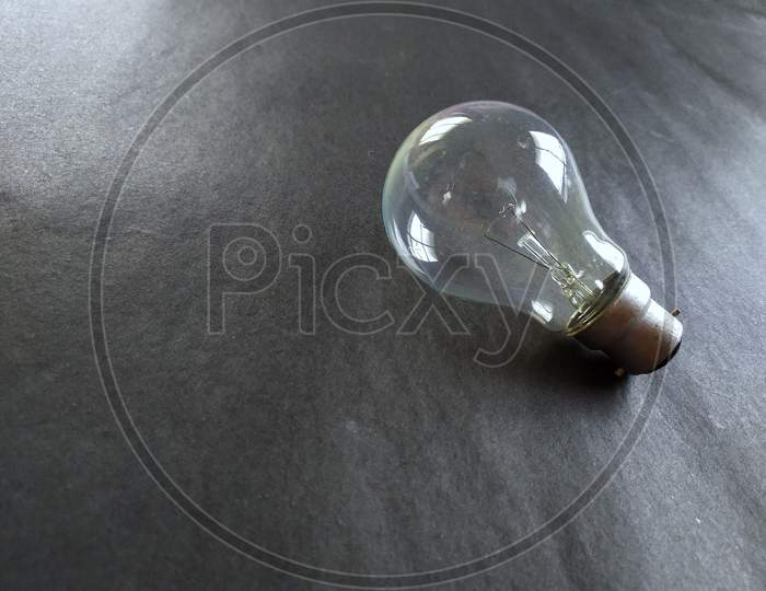 Light bulb on black background.