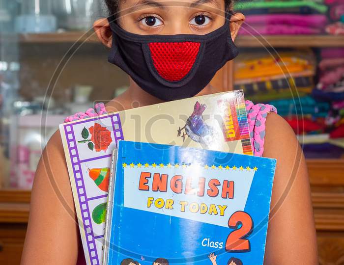 Bangladesh – April 15, 2020: A Teenage Girl Wearing A Protective Cloth Mask Against Transmissible Covid-19 Diseases And She Stay His Home At Dhaka.