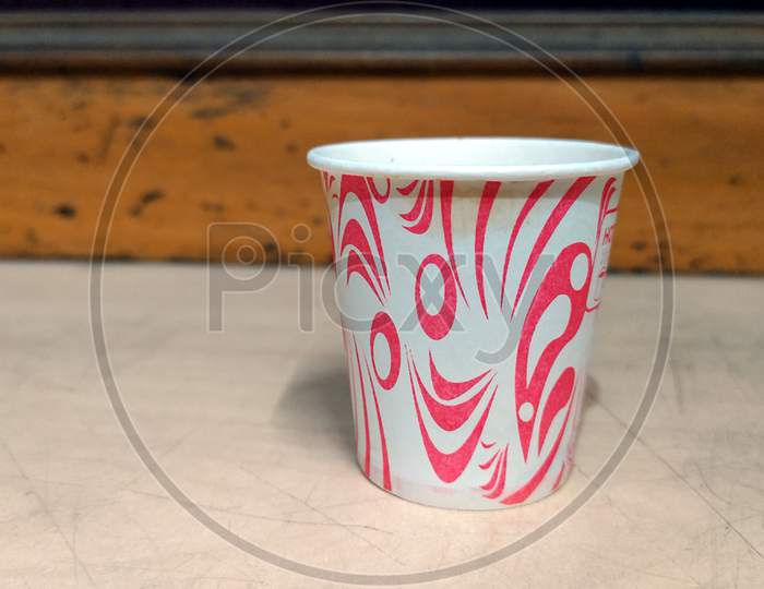 red and white paper Coffee in opened disposable cup