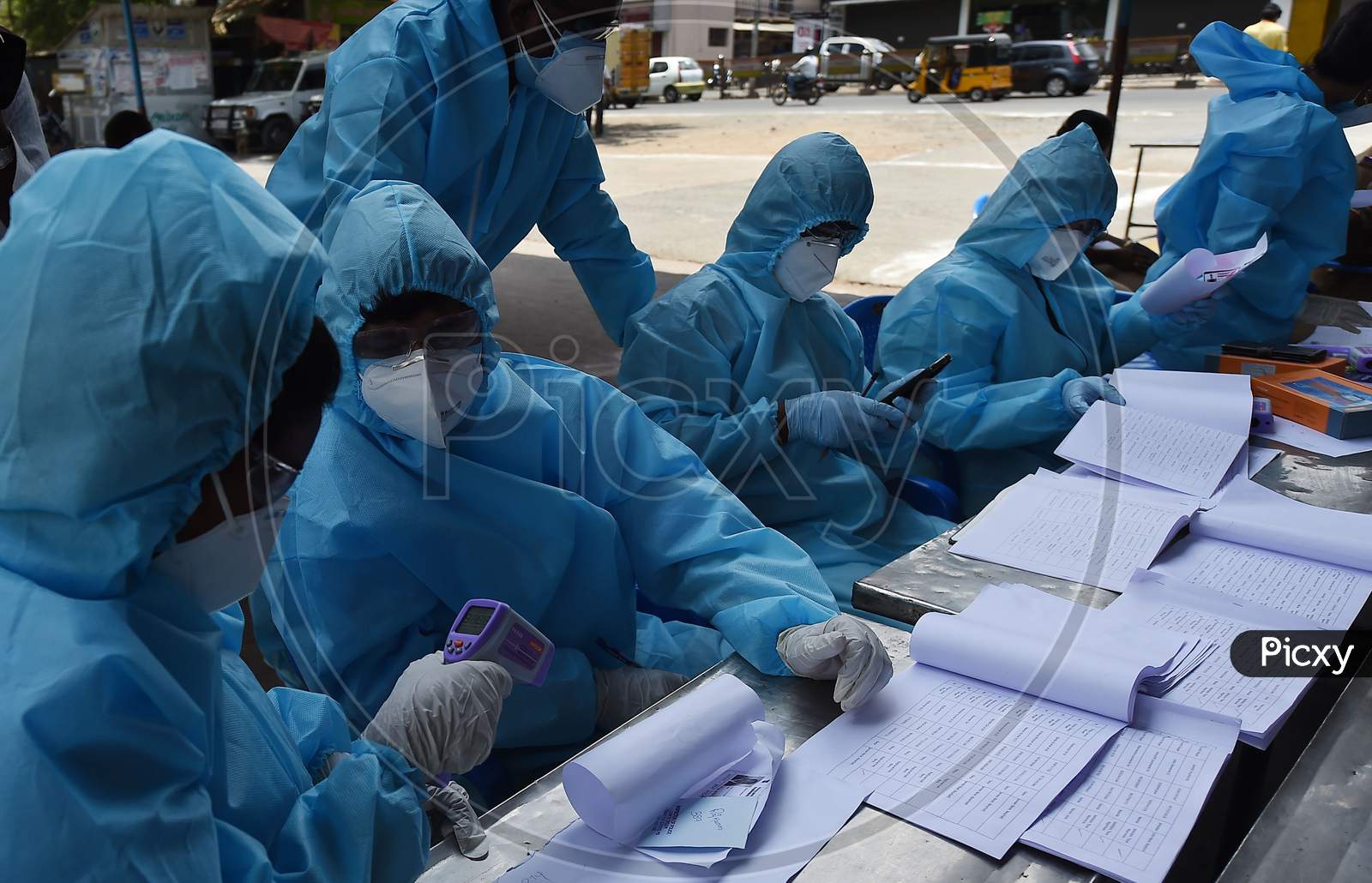 Health Workers Conducting The Thermal Screening Of Migrant Labourers From Bihar During The Ongoing Nationwide Lockdown In The Wake Of Coronavirus Pandemic, In Chennai
