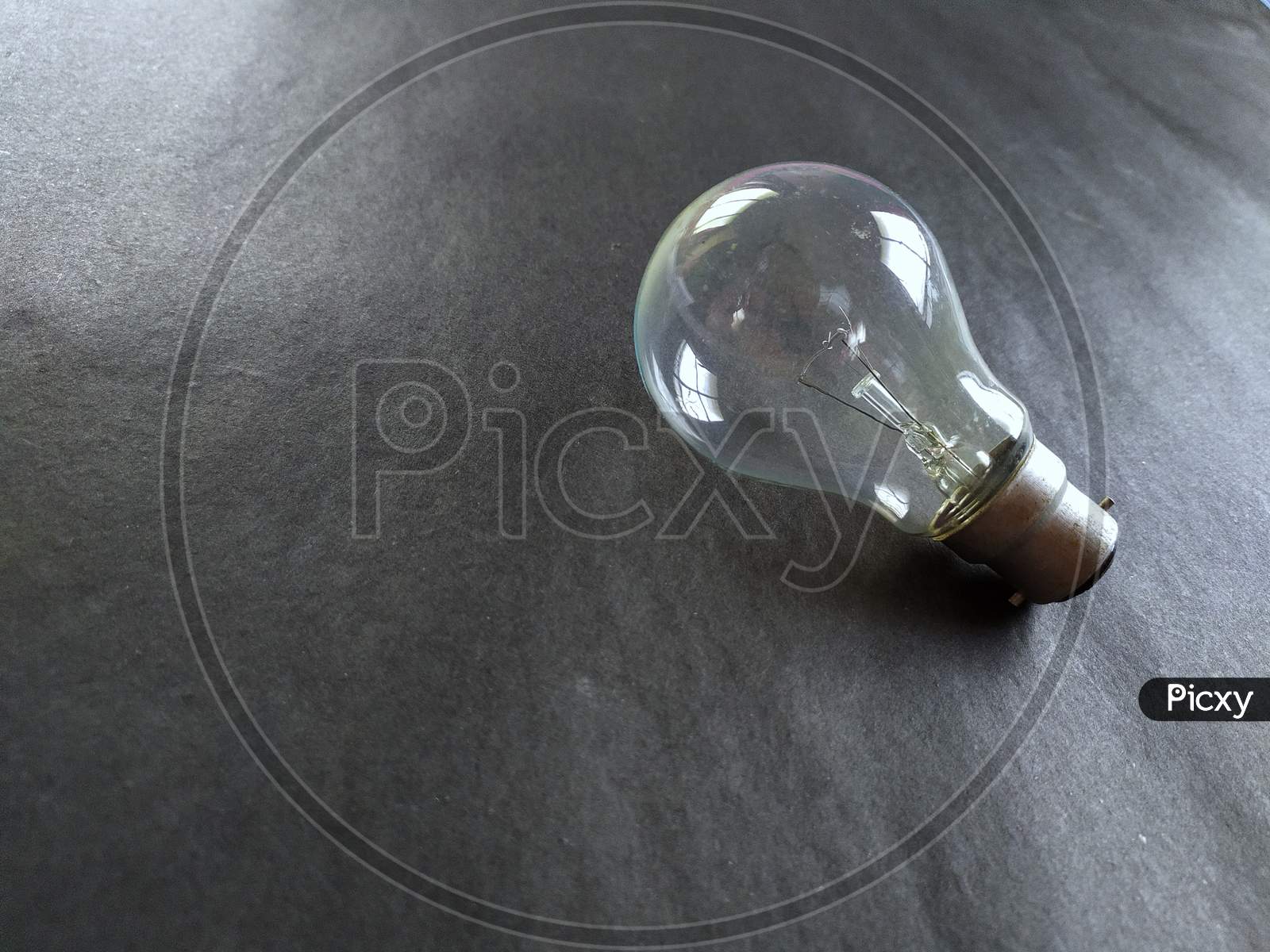 Light bulb on black background.