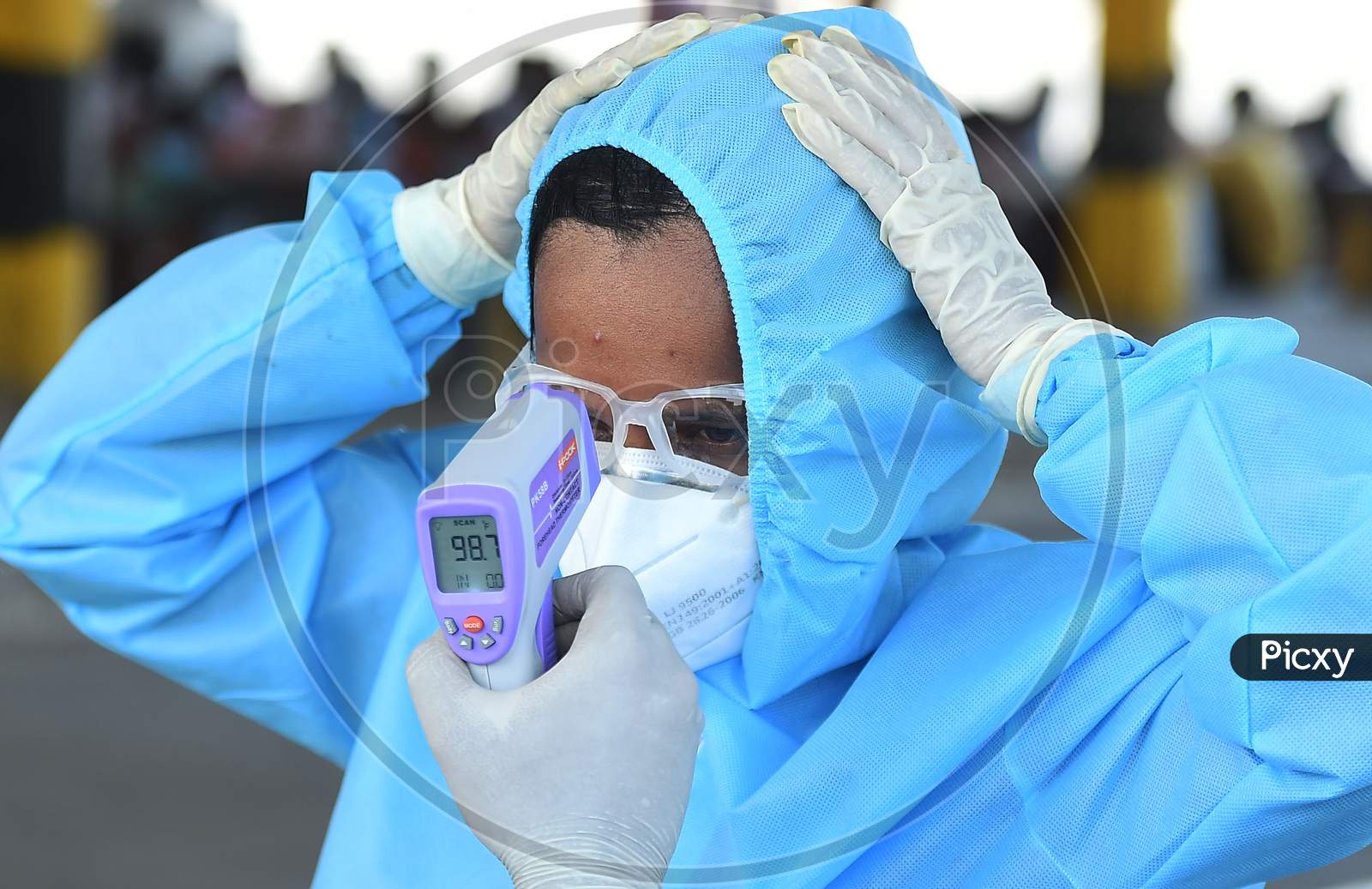 Health Workers Conducting The Thermal Screening During The Ongoing Nationwide Lockdown In The Wake Of Coronavirus Pandemic, In Chennai