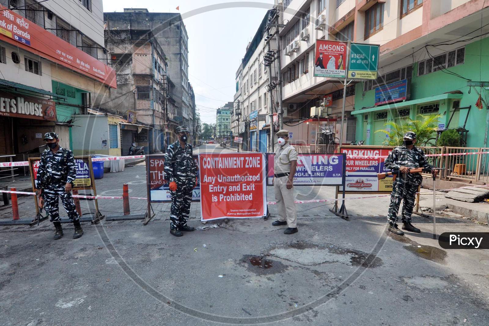 Security Personnel Stand at Containment Zone Area At Fancy bazar which Sealed After 16 People Were Tested Positive For Coronavirus, During Nationwide Lockdown Amidst Coronavirus or COVID-19 Pandemic  In Guwahati,India
