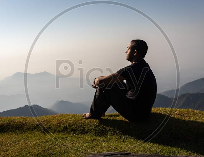 Isolated Man Watching Sunrise
