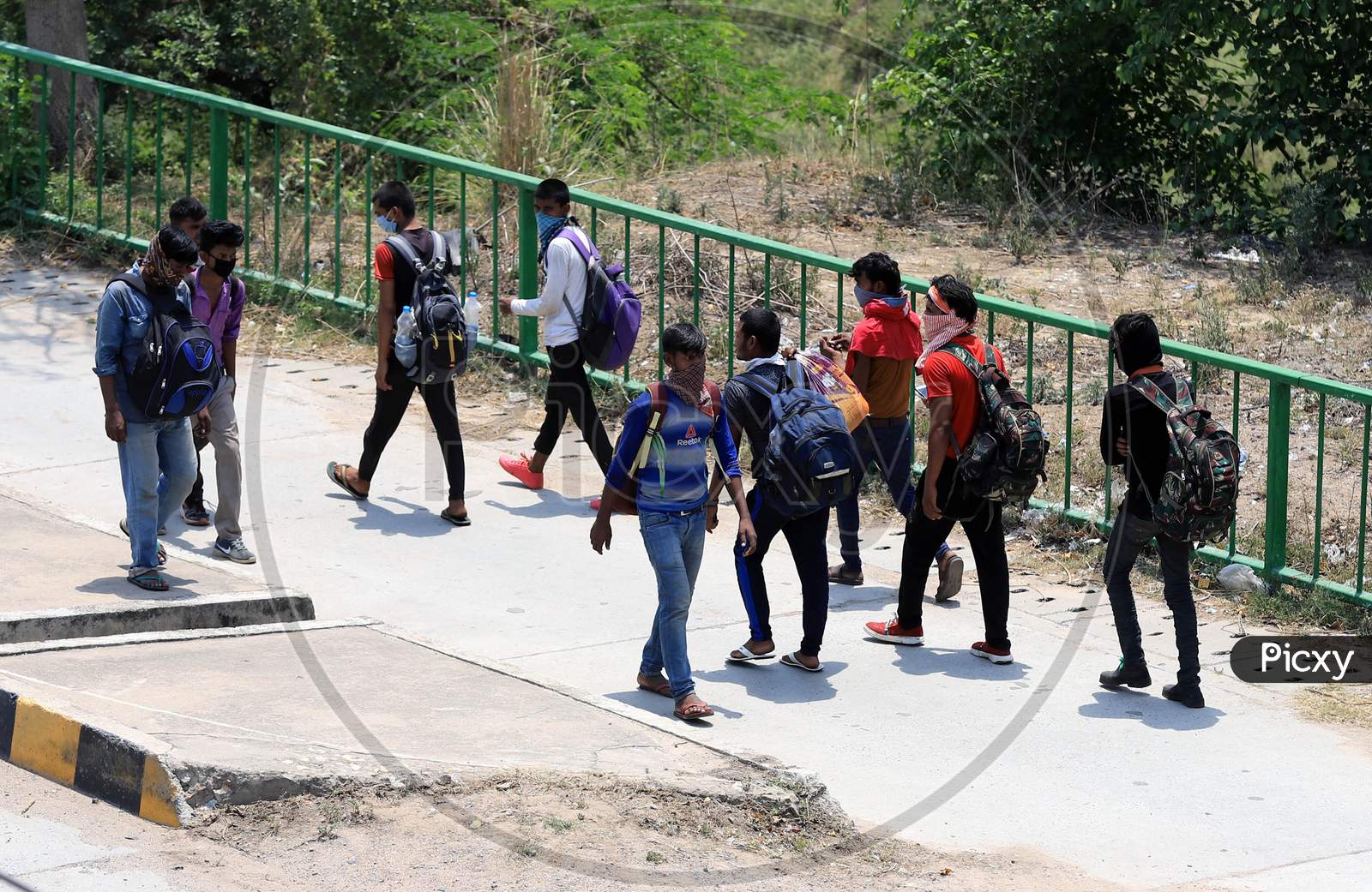 Migrants From Mumbai Walking To Their Native Places  During Extended Nationwide Lockdown Amidst Coronavirus Or COVID-19 Pandemic in Prayagraj .