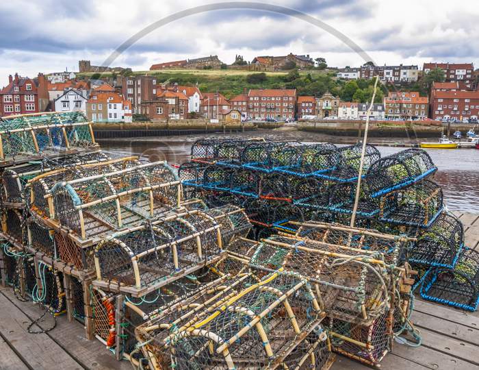 A pile of lobster pots lined up on Whitby harbour side