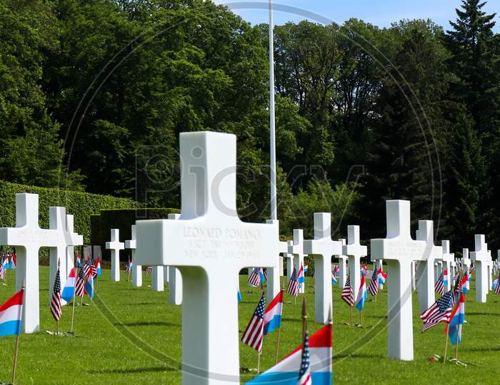 American Flag Flying In A Military Cemetery