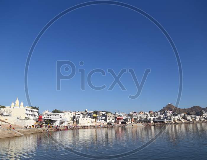 Pushkar Lake Or Pushkar Sarovar Is Located In The Town Of Pushkar In Ajmer District Of The Rajasthan State Of Western India. Pushkar Lake Is A Sacred Lake Of The Hindus. Pushkar, India 22 August 2017.