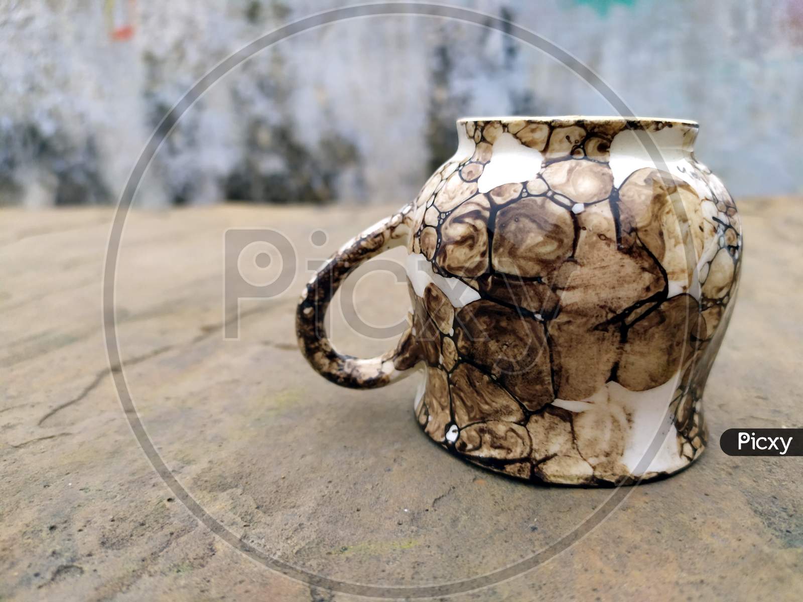 a clay tea cup isolated on stone background