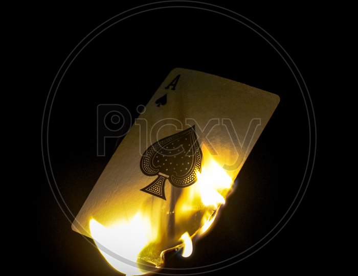 Burning card in dark background