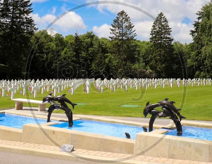 Dolphin Fountain At A Military Cemetery.