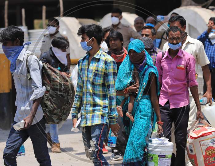 Migrants From Surat (Gujrat) Arrived By A Special Train Boarding  Buses To Their Native Places During Extended Nationwide Lockdown Amidst Coronavirus Or COVID-19 Pandemic in Prayagraj