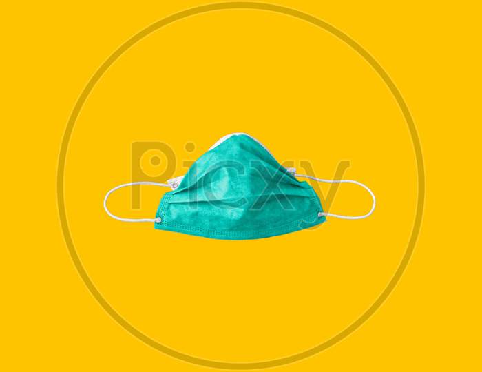 Medical protective mask on Yellow background, Prevent Coronavirus, protection factor for wuhan virus, With clipping path