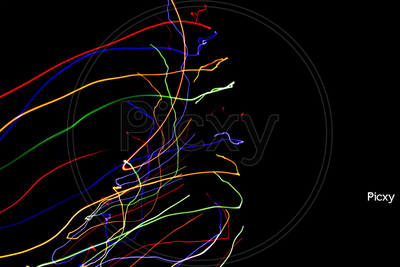 Abstract Colorful Lines On Black Background. Light Painting Photography With Irregular Patterns For Overlay. Resource For Designers.
