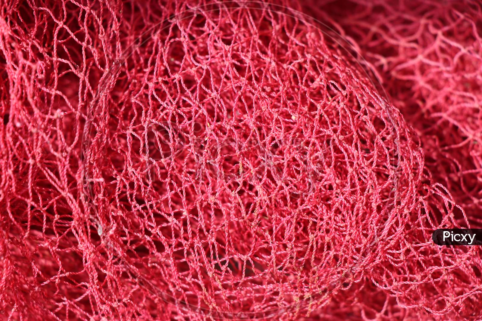 Image of Fishing Net Which Is Red In Color Closeup Shot-XX616968-Picxy