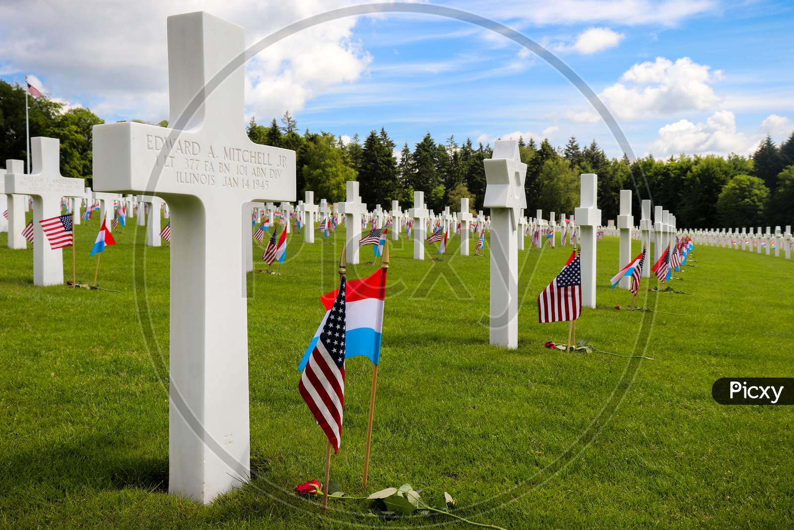 Headstones In A Row At A Military Cemetery.