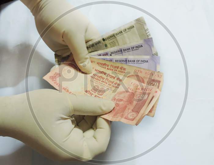 Cash counting with hand gloves