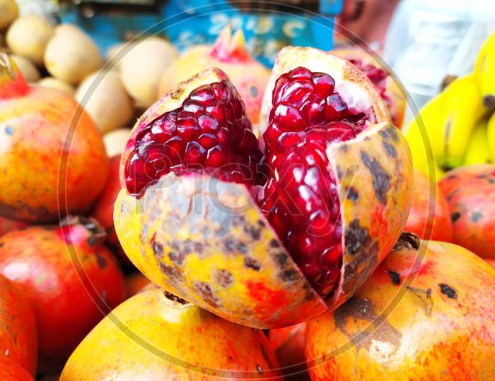 red fresh sweet pomegranate put on a shop