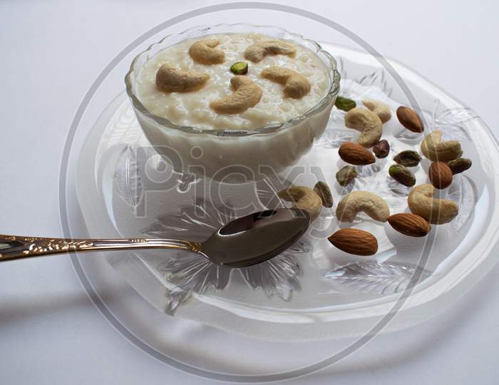 Side View Close Up Of Transparent Bowl Filled With Kheer khir An Authentic Indian, Pakistani Dessert Made During Festivals In Feast