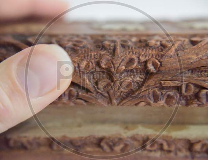 Hand On The Carved Wooden Box. Selective Focus