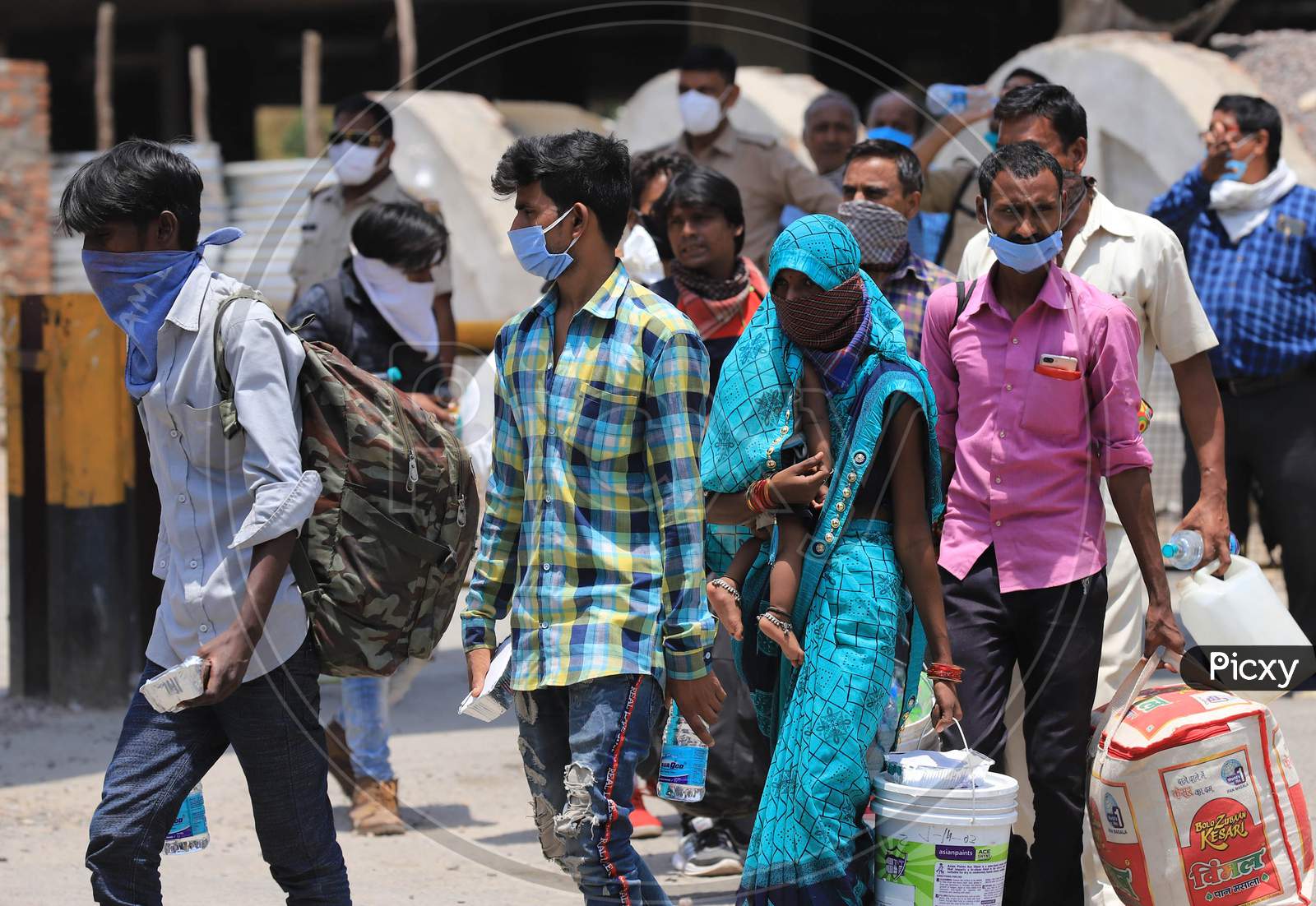 Migrants From Surat (Gujrat) Arrived By A Special Train Boarding  Buses To Their Native Places During Extended Nationwide Lockdown Amidst Coronavirus Or COVID-19 Pandemic in Prayagraj