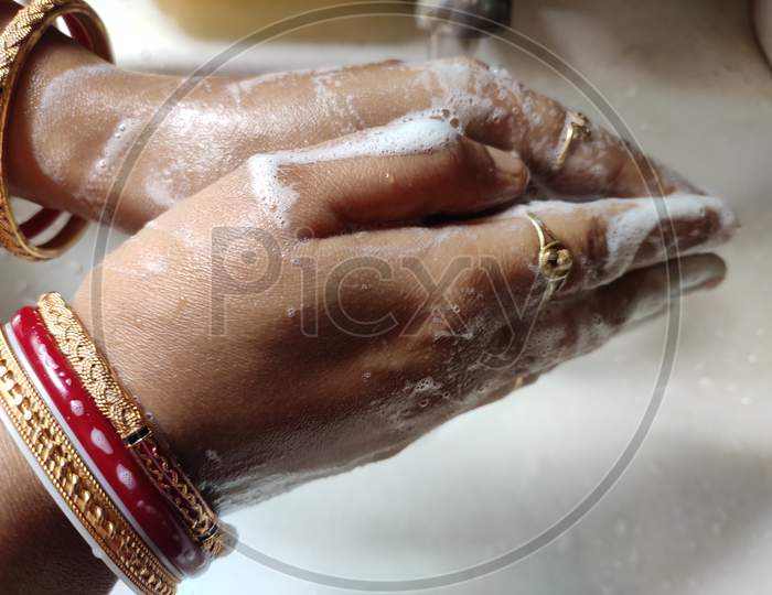 Indian woman washing hands