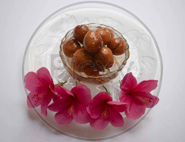 Top View Of Yummy Gulab Jamun Milk-Solid Based Popular And Traditional Sweet Dessert Indian Cuisine Dish Eaten During Festival Feast. Decorated