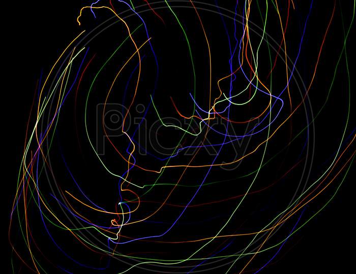 Abstract Colorful Lines On Black Background. Light Painting Photography With Irregular Patterns For Overlay. Resource For Designers.