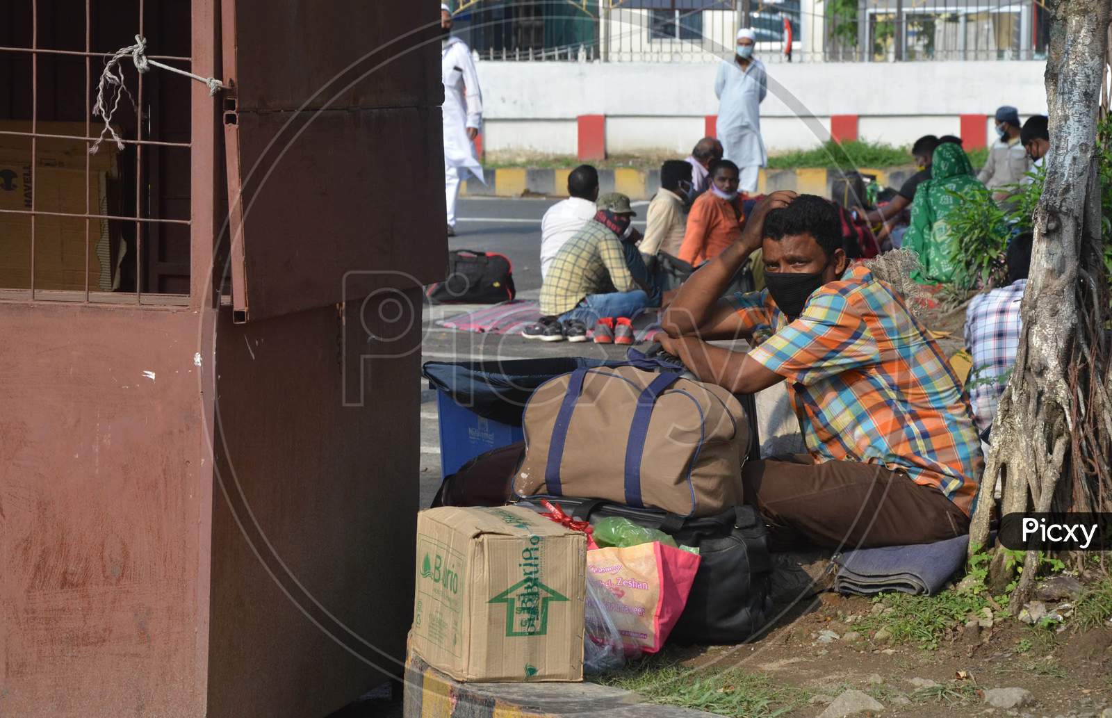 Passengers Wait Outside At Guwahati Railway Station Before Boarding A Special Train To Reach Their Native Places, During Nationwide Lockdown Amidst Coronavirus or COVID-19 Pandemic  In Guwahati District Of Assam,India