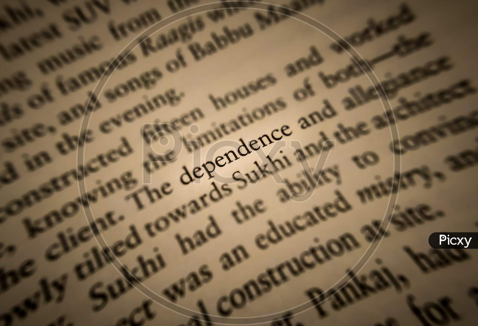 Dependence Word Highlighted And Focused In An Old Book.