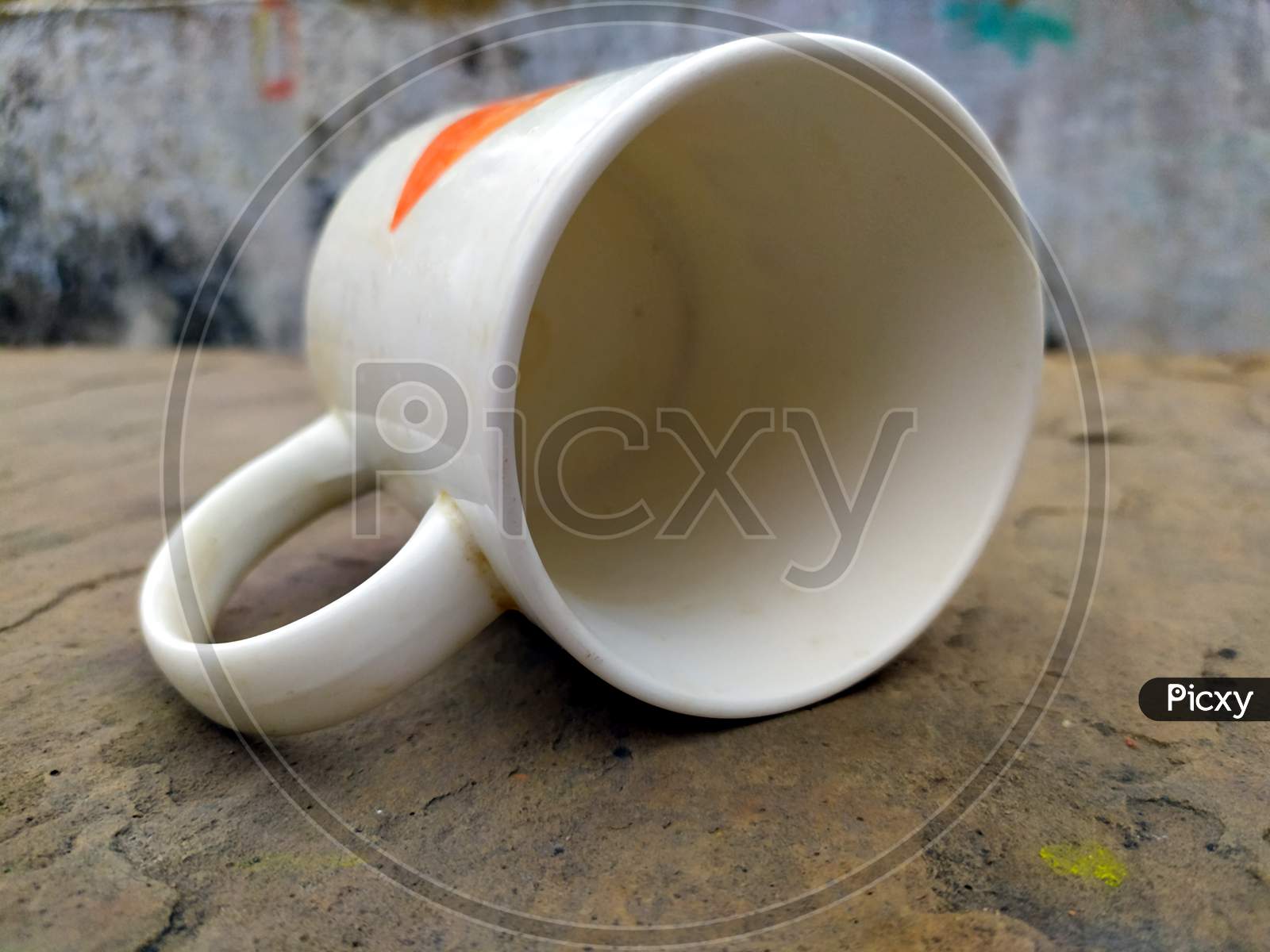 a clay tea cup isolated on stone background