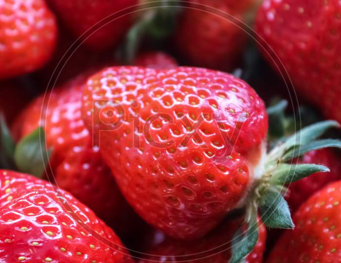 Close up on natural background of red strawberries ready for eating