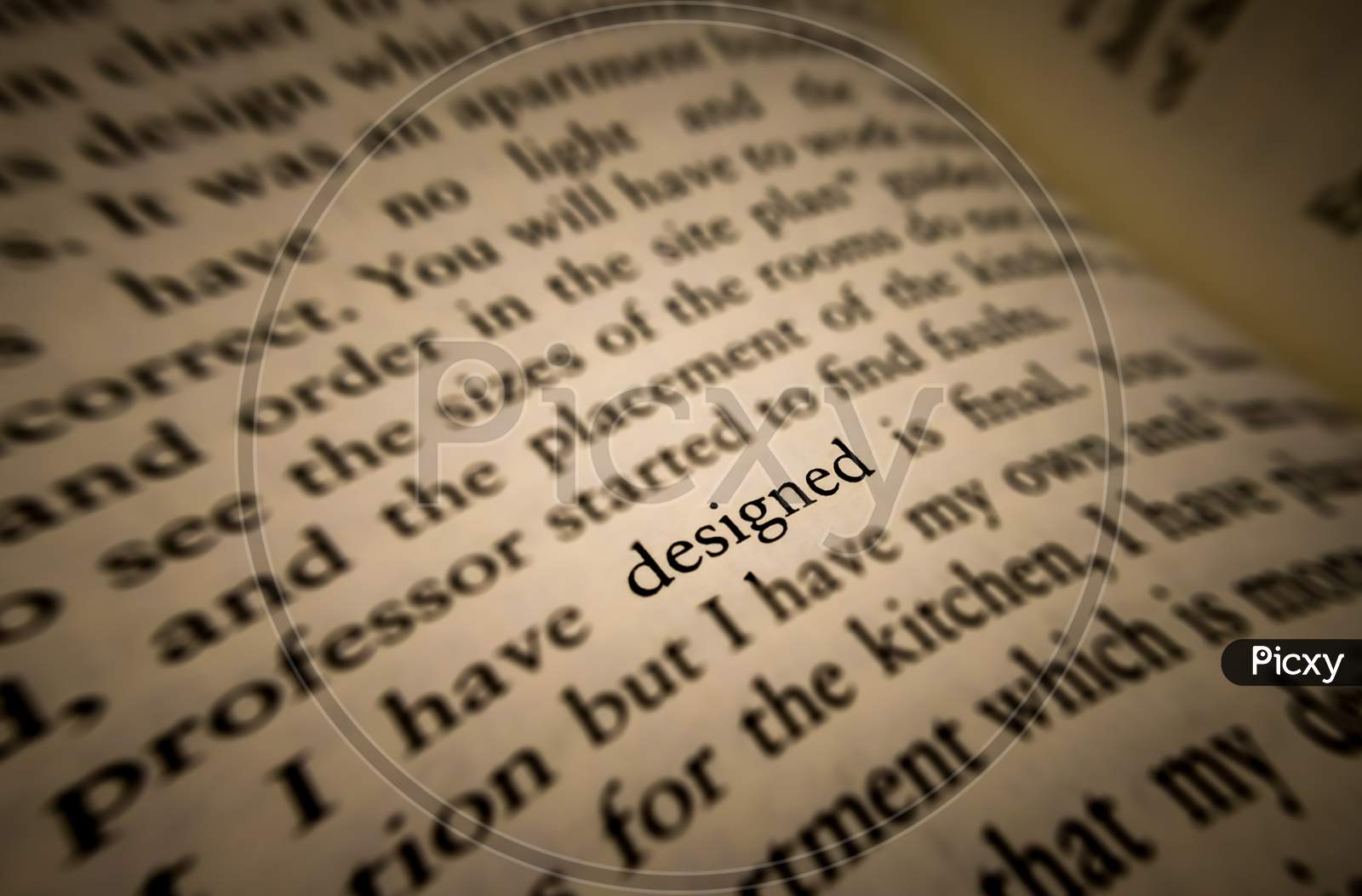 Designed Word Highlighted And Focused In An Old Book.