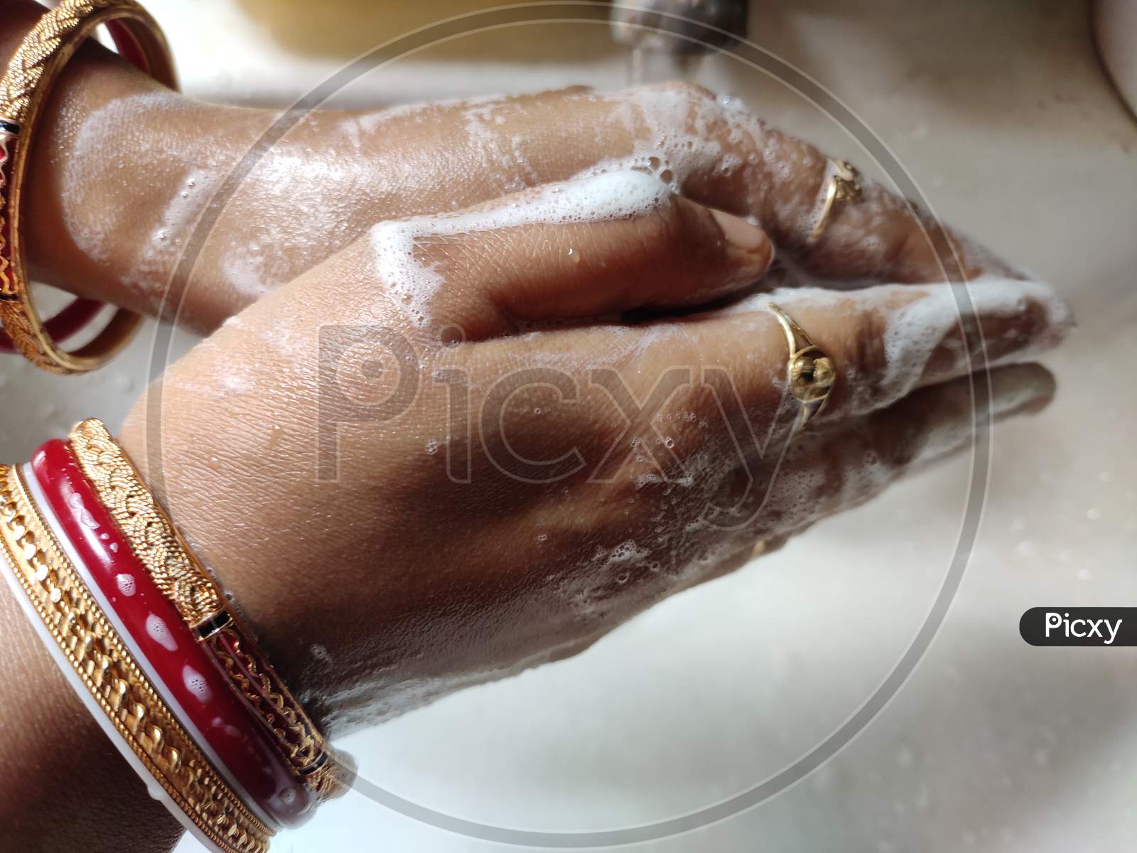 Indian woman washing hands