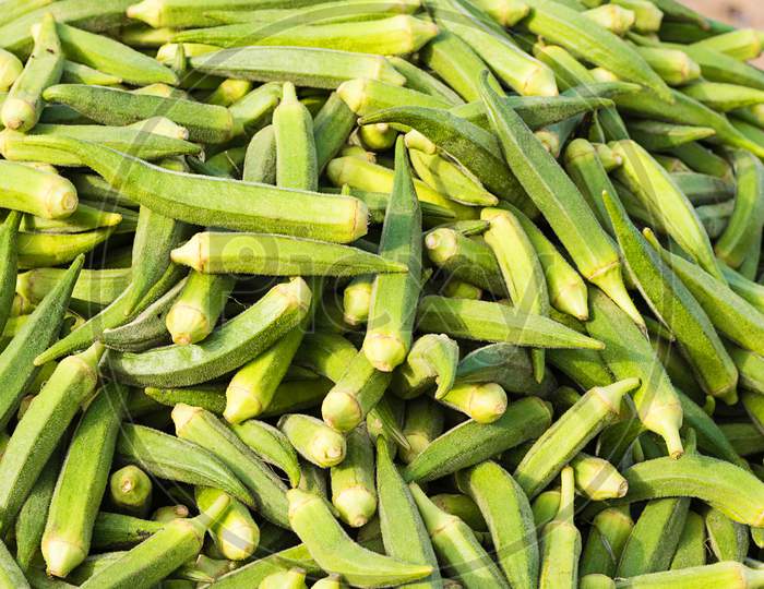 Fresh Organic Ladyfinger On Market, Agriculture And Food Concept, Background