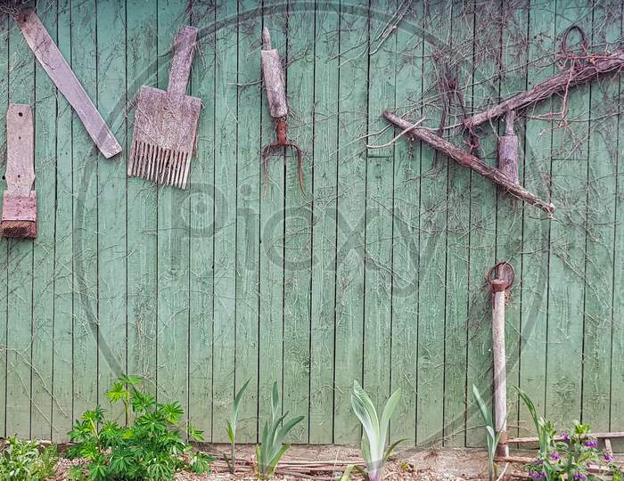 A Deceased Wall With Garden Tools Tagged in an House Garden