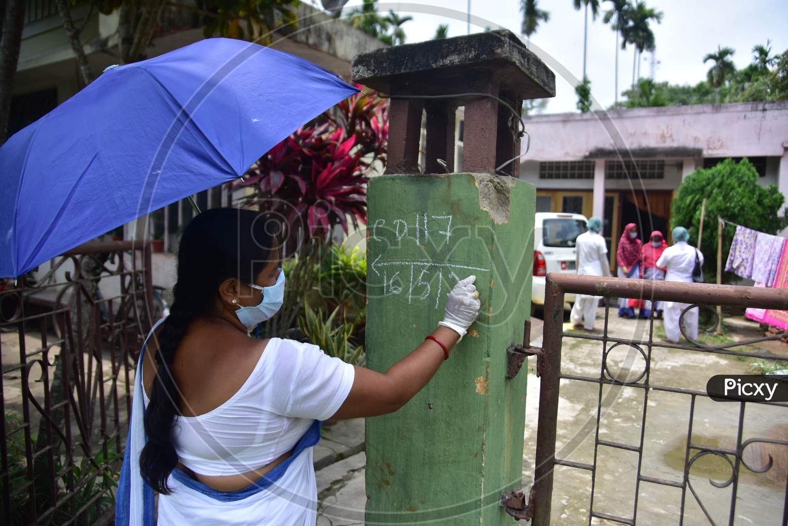 A Health Worker Numbering On A Wall  As They Conduct House To House Health Survey During Nationwide Lockdown Amidst Coronavirus or COVID-19 Pandemic  In Nagaon District Of Assam,India