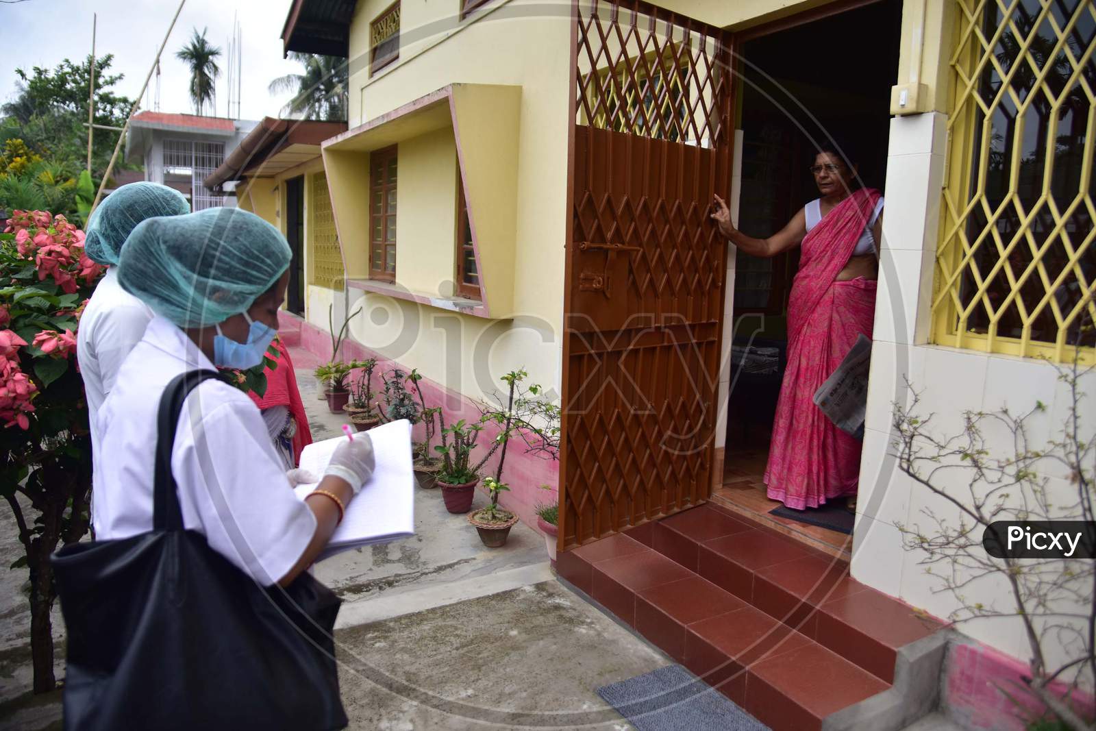 Health Worker Conducting  House To House Health Survey  During Nationwide Lockdown Amidst Coronavirus or COVID-19 Pandemic  In Nagaon District Of Assam,India