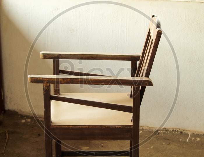 Side View Of An Old Wooden Chair.