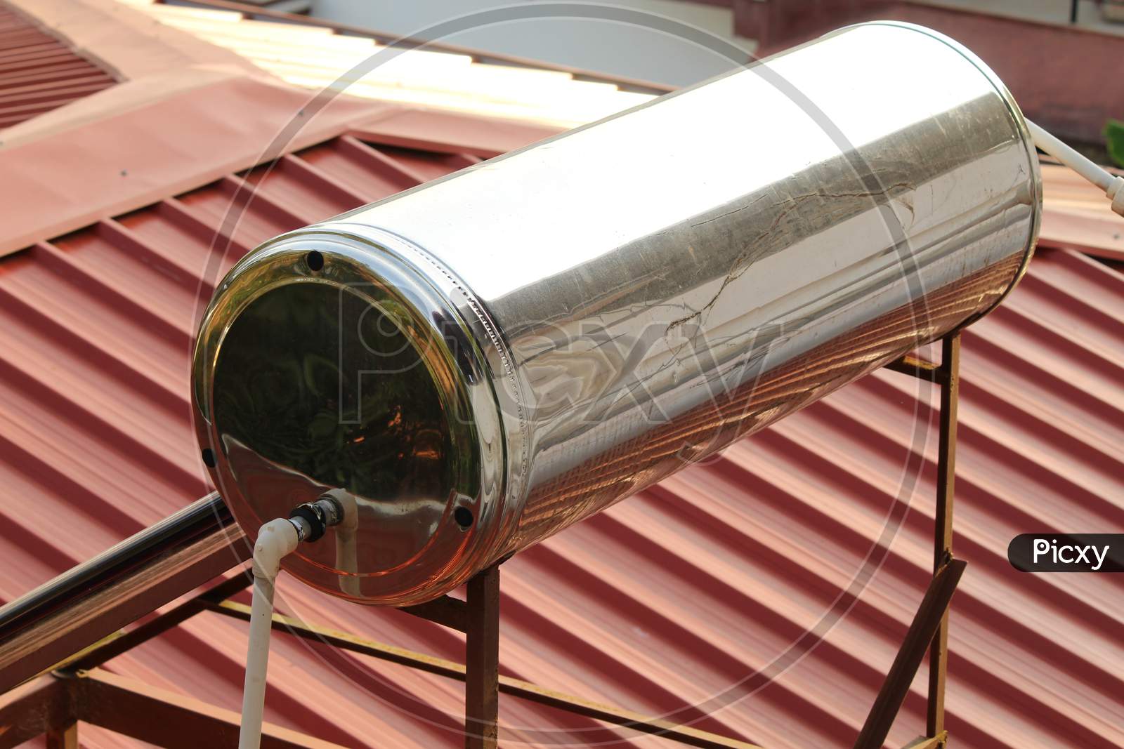 Solar Water Heater Tank Installed On The Top Of The Roof Of A Building
