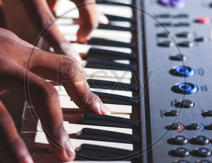 Music Magician Playing The Electronic Keyboard In Music Recording Studio Close Up On Hands. Playing Electronic Piano.