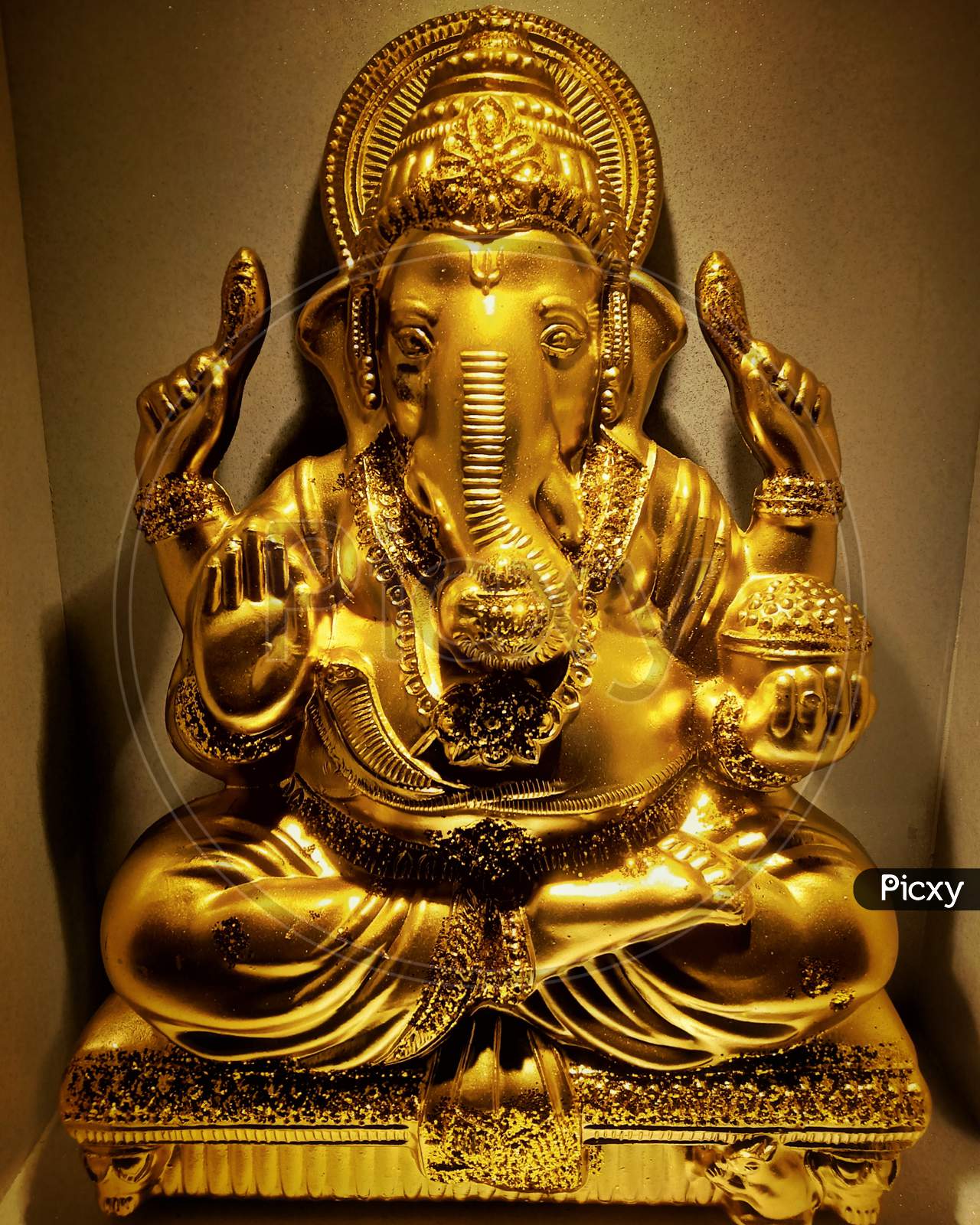 Lord ganesha. Gold sculpture of lord ganesha.