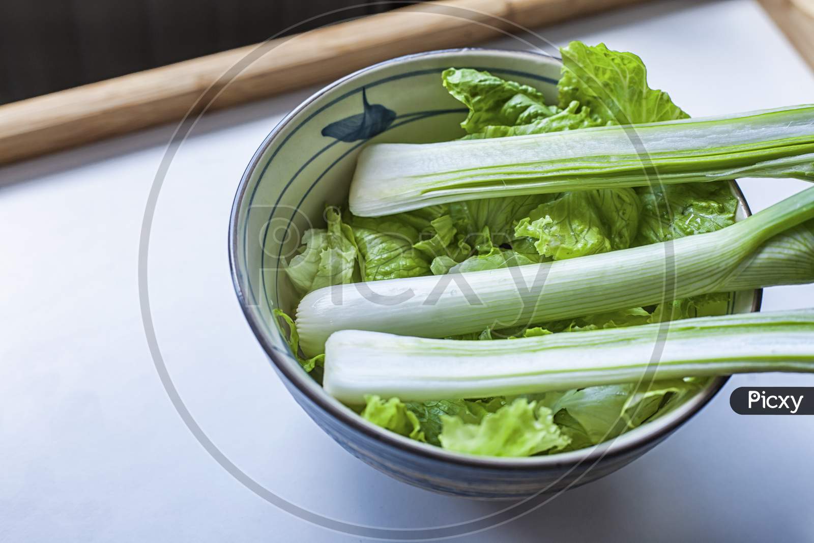 Green Onion And Lettuce In A Bowl