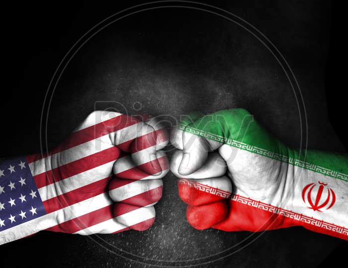 Conflict Between Usa And Iran, Male Fists With Flags Painted On Skin Isolated On Black Background - Governments Conflict Concept