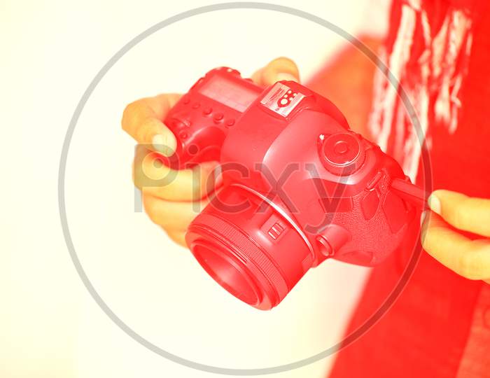 Closeup Of Man Hand Using Dslr Camera, Red Colorful Trendy Fashion Style.- Image