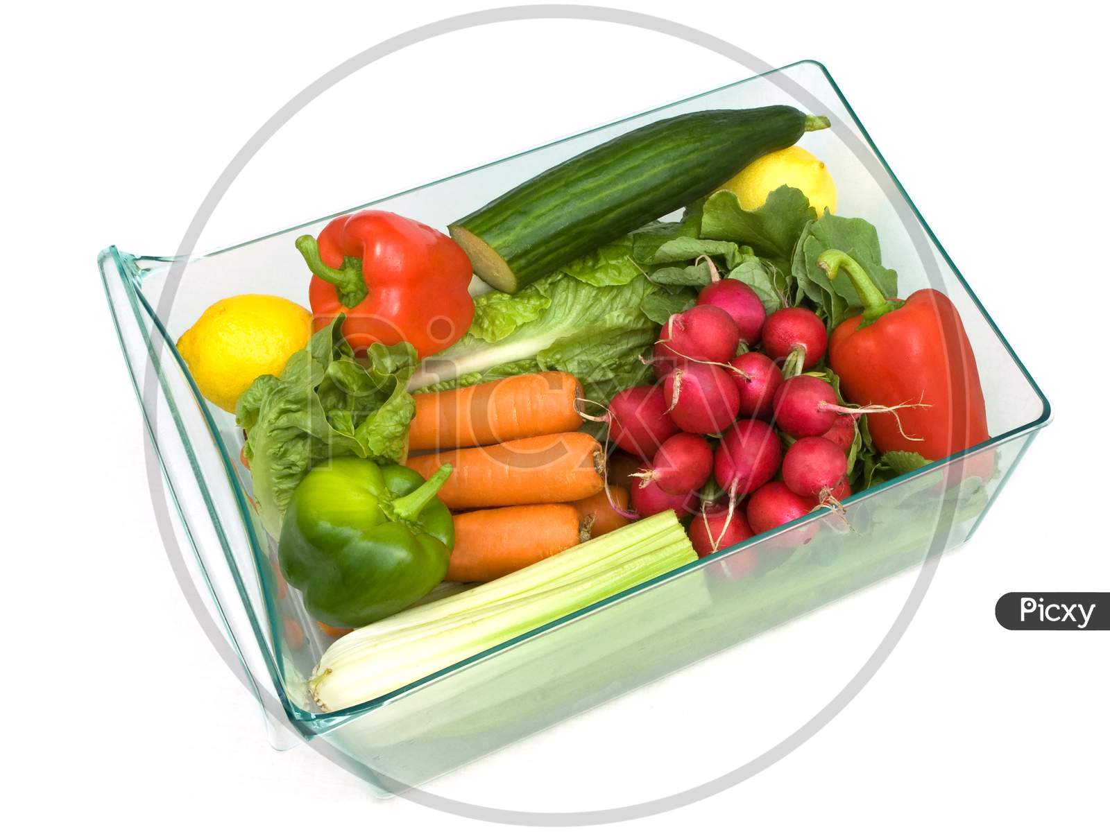 Refrigerator vegetable drawer full with a selection of vegetables